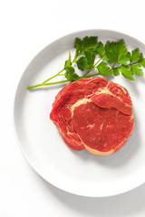 Raw meat steak on a plate