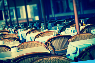 Obraz premium Empty Street cafe in Paris on a summer morning