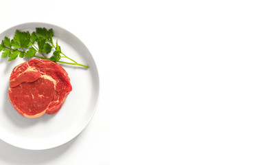 Raw meat steak on a plate