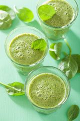 healthy green spinach smoothie with leaves