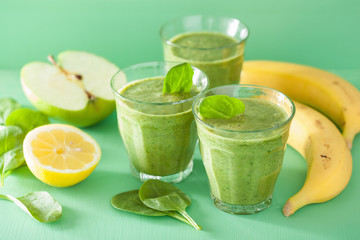 healthy green spinach smoothie with apple lemon banana