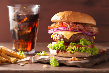 bacon cheese burger with beef patty tomato onion © Olga Miltsova