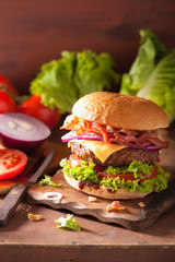 bacon cheese burger with beef patty tomato onion