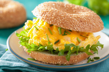 breakfast sandwich on bagel with egg cheese lettuce