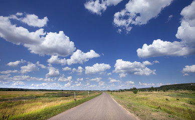 on the road with clouds
