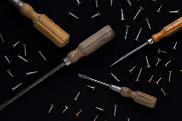 Accessory, assorted tools set on wooden light background. Construction assortment instruments for repairman, carpenter, builder. Copy space for text. Top view. 
