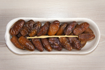 Dates are in the package on wooden background 