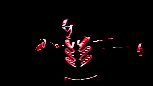 4 people dancing in costumes of LEDs 