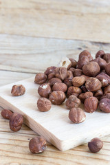 Bunch of hazelnuts on the rustic wooden boards table