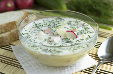 Summer cold vegetable soup on yogurt. Traditional russian summer soup - cold okroshka.