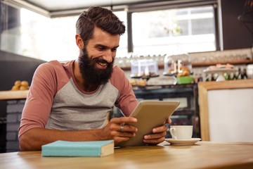 Man using a tablet sitting