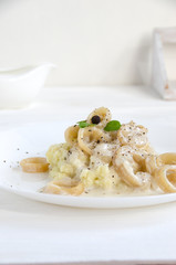 squid rings potato puree sauce white plate
