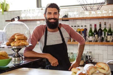 Waiter leaning against counter