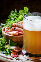 Beer and shrimp, vintage wooden background, selective focus