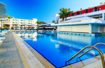 Fototapeta na wymiar large swimming pool at the resort on the shores of the Aegean Sea Greece Rhodes