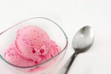 Strawberry ice cream in a bowl isolated on white background

