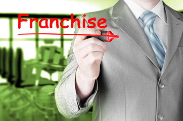 business man writing franchise