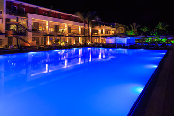 swimming pool with lighting in the spa modern European hotel at night