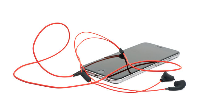 Red Headphones In A Smart Phone Isolated