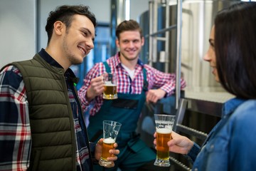Brewers testing beer at brewery factory
