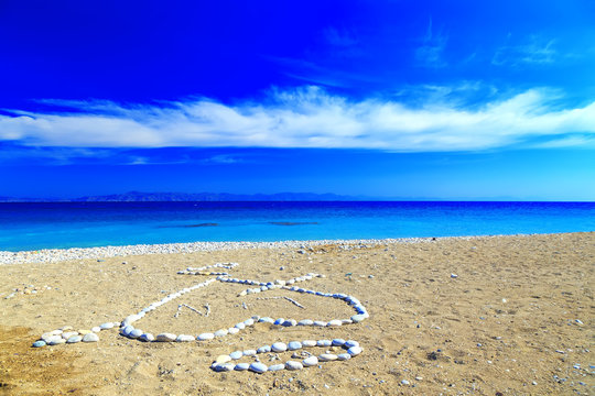 heart of stone, and the first letters of the names laid out on the shore of pebble beach