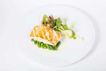 Fried white fish fillet with garnish