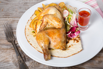 Fried chicken with baked potato garnish
