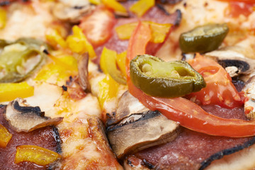 Fototapeta na wymiar Close-up fragment of a mexican pizza