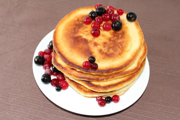 Pancakes with cranberries and black currants