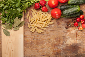 Italian food ingredients on flat wooden background