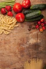 Italian food ingredients on flat wooden background