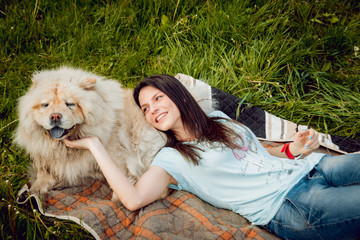Obraz premium Young woman with the dogs in the park.