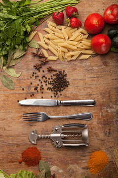 Italian food ingredients on flat wooden background
