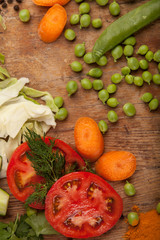Vegetables and pasta on wood background. Bio Healthy food, herbs and spices. Organic vegetables