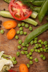 Vegetables and pasta on wood background. Bio Healthy food, herbs and spices. Organic vegetables