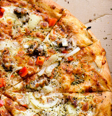 Italian pizza with sausage, red peppers and cheese mozzarella, onion, rosemary and basil