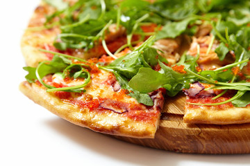Pizza with seafood and arugula isolated on white