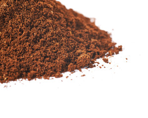 Pile of the ground coffee flakes isolated