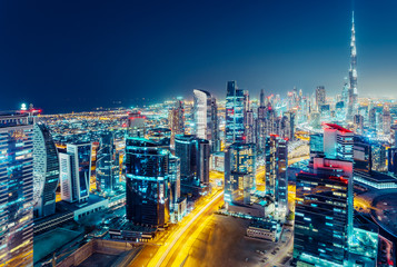 Fototapeta na wymiar Aerial view over a big modern city at night. Business bay, Dubai, United Arab Emirates.