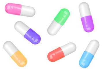 Many colorful pills isolated on white