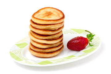 fritters on a plate with strawberries isolated white background