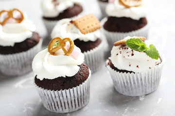 Chocolate cupcakes on a grey background