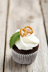Chocolate cupcake on a grey wooden table
