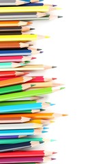 Fototapeta premium Drawing colourful pencils on a white background, close up