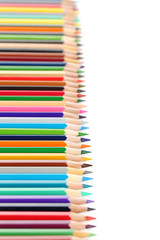 Drawing colourful pencils on a white background, close up