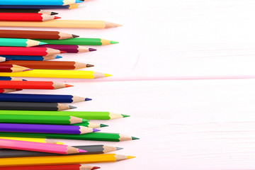 Obraz premium Drawing colourful pencils on a wooden background