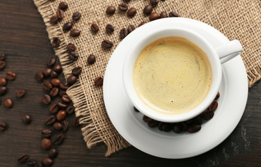 Cup of coffee on wooden background