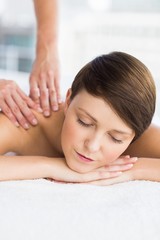Obraz na płótnie Canvas Relaxed woman enjoying massage