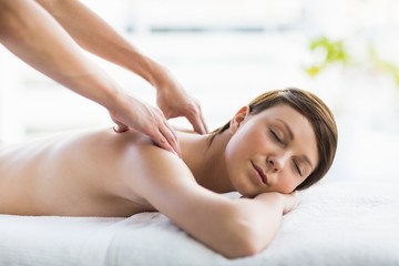 Obraz na płótnie Canvas Relaxed beautiful woman enjoying back massage