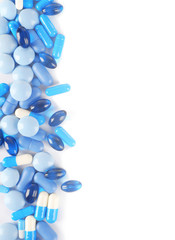 Blue pills isolated on white